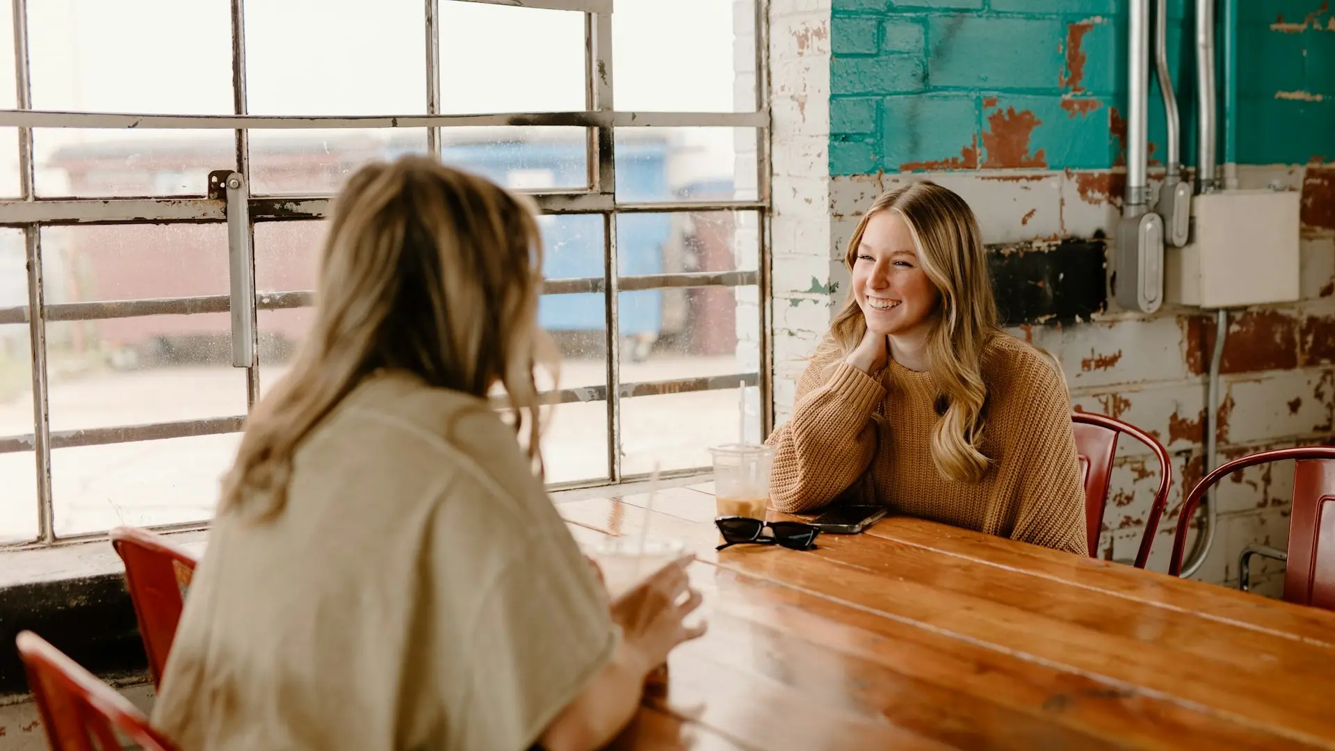 Two people sitting at a table in conversation